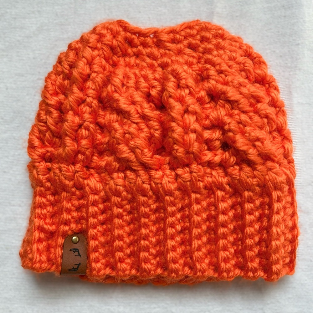 Adult sized handmade crocheted blaze orange hunting beanie for ponytail.